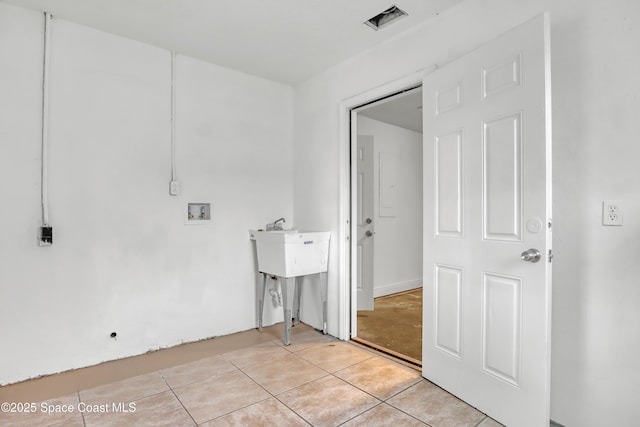 282 Hollywood Blvd, Melbourne, FL 32904 - washroom with light tile patterned flooring and washer hookup