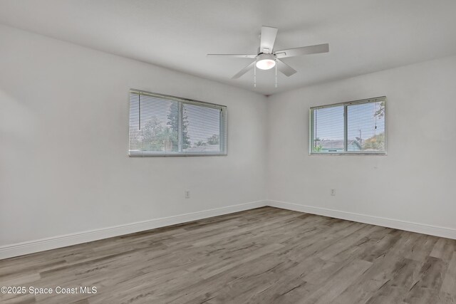 282 Hollywood Blvd, Melbourne, FL 32904 - unfurnished room featuring ceiling fan, plenty of natural light, and light hardwood / wood-style flooring