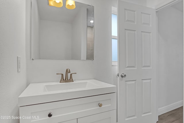 282 Hollywood Blvd, Melbourne, FL 32904 - bathroom with vanity, plenty of natural light, and hardwood / wood-style floors