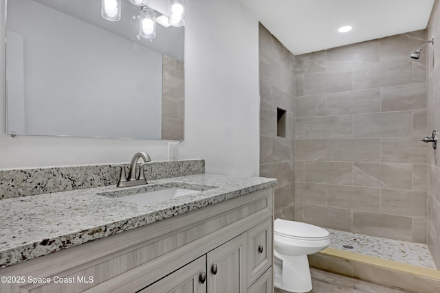 282 Hollywood Blvd, Melbourne, FL 32904 - bathroom with vanity, toilet, and a tile shower