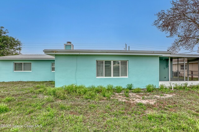 282 Hollywood Blvd, Melbourne, FL 32904 - view of side of property featuring a yard