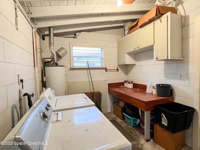 clothes washing area with cabinets, separate washer and dryer, and water heater