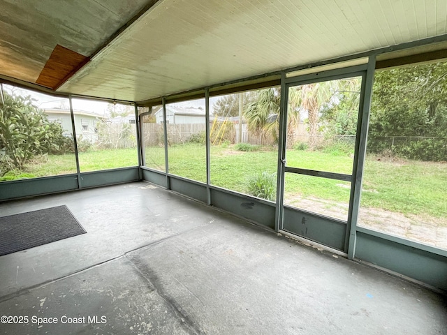 unfurnished sunroom with a wealth of natural light