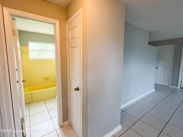 corridor featuring light tile patterned floors