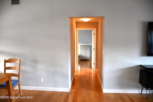 corridor featuring light hardwood / wood-style flooring