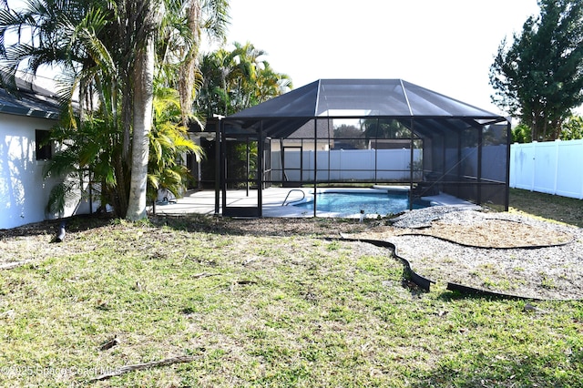 view of yard featuring a fenced in pool, a lanai, and a patio area