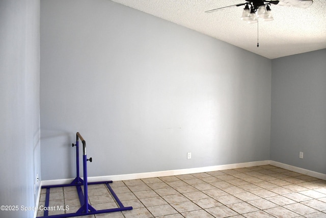 unfurnished room featuring light tile patterned flooring, ceiling fan, and a textured ceiling