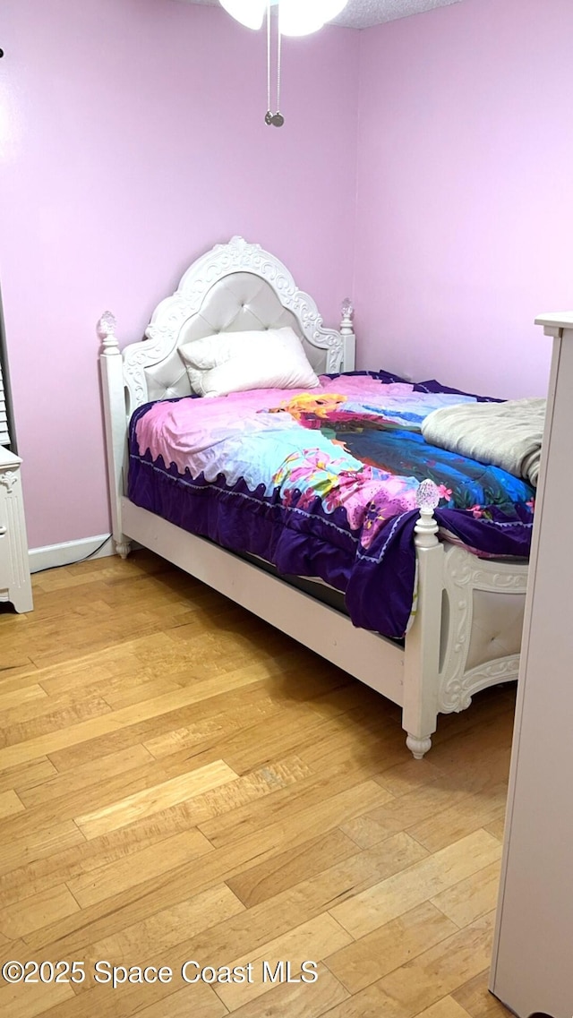 bedroom with light wood-type flooring