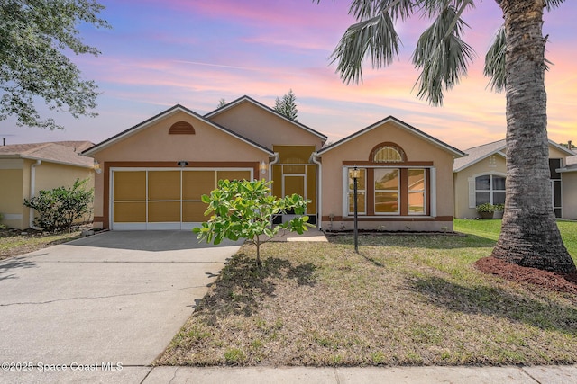 1235 White Oak Cir, Melbourne, FL 32934 - view of front of property featuring a garage and a yard