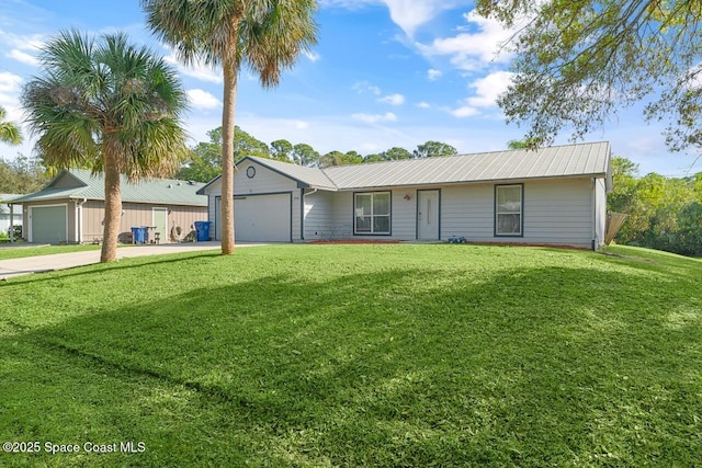 ranch-style home featuring a garage and a front lawn