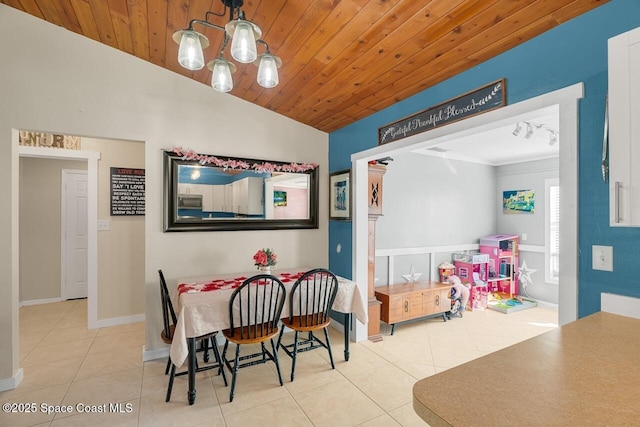 tiled dining area with an inviting chandelier, lofted ceiling, and wooden ceiling