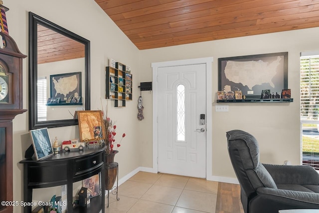 foyer featuring light tile patterned flooring, vaulted ceiling, and wood ceiling