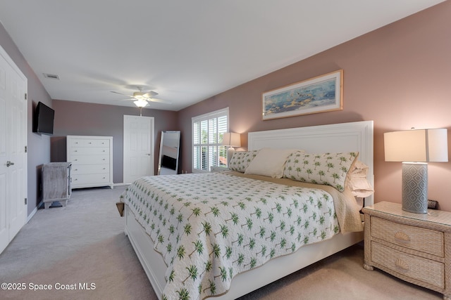 carpeted bedroom featuring ceiling fan