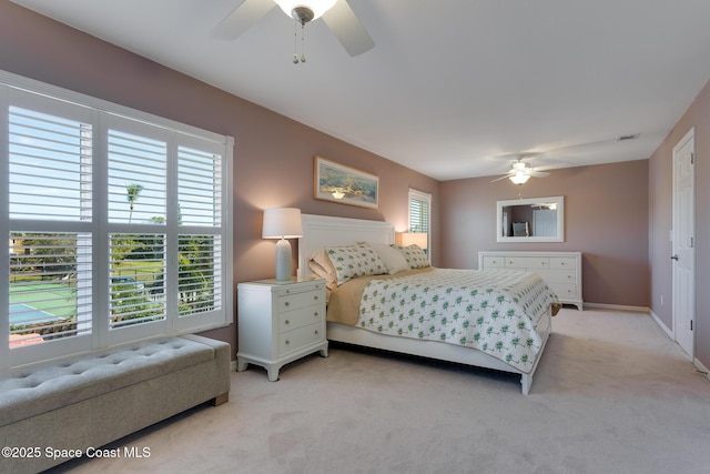 carpeted bedroom featuring ceiling fan