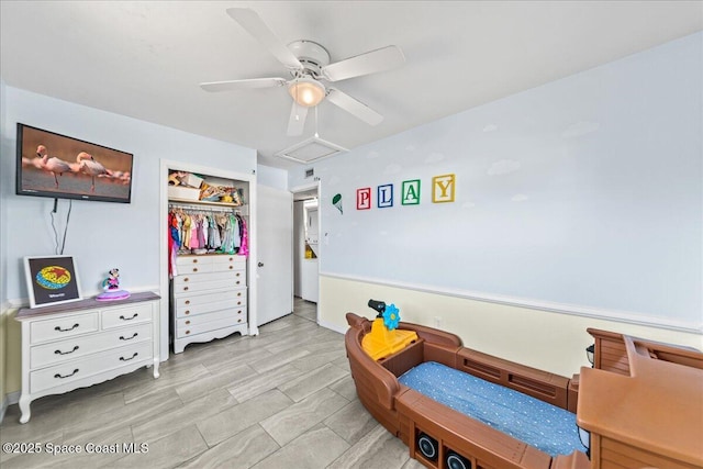 bedroom with ceiling fan and a closet