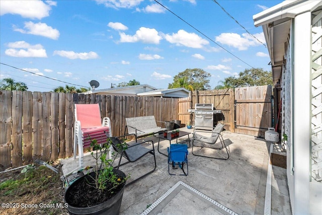 view of patio with a grill