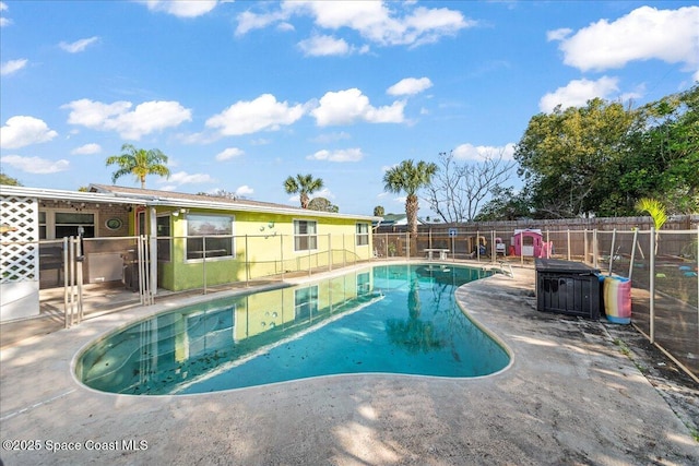 view of swimming pool with a patio area