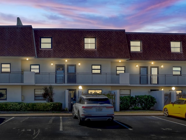 view of outdoor building at dusk