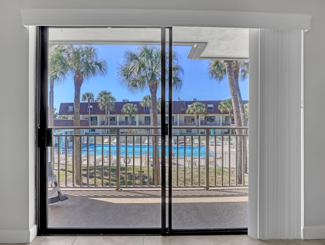 doorway to outside with a healthy amount of sunlight and tile patterned floors