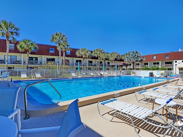 view of swimming pool with a patio