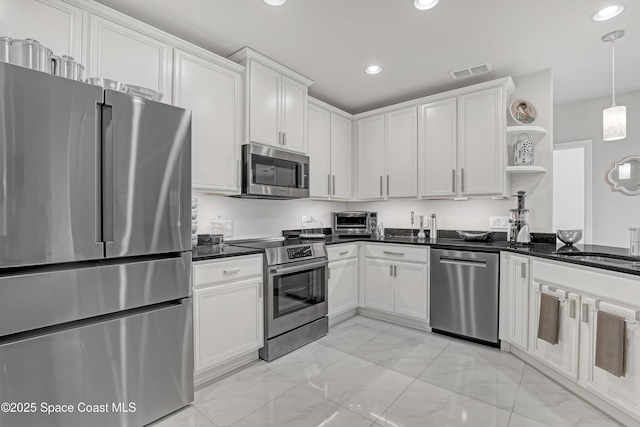 kitchen featuring visible vents, open shelves, dark countertops, white cabinetry, and appliances with stainless steel finishes