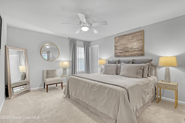 bedroom with light carpet, a ceiling fan, and baseboards