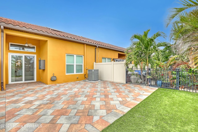 view of patio / terrace with cooling unit and fence