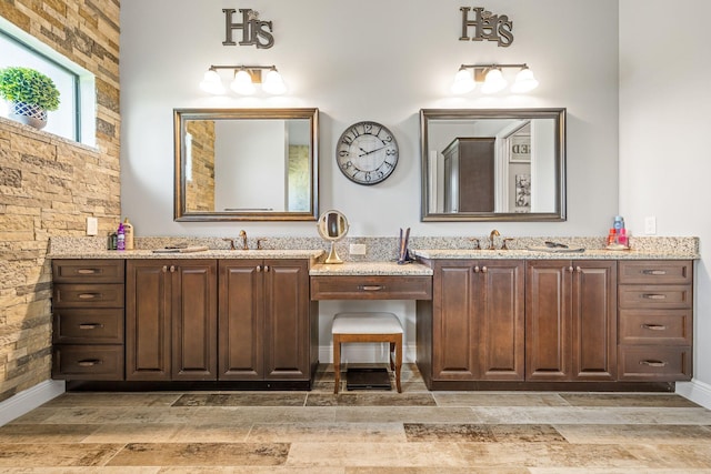 bathroom featuring vanity and hardwood / wood-style floors