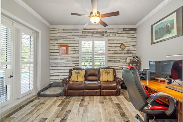 home office with crown molding, light hardwood / wood-style flooring, and ceiling fan