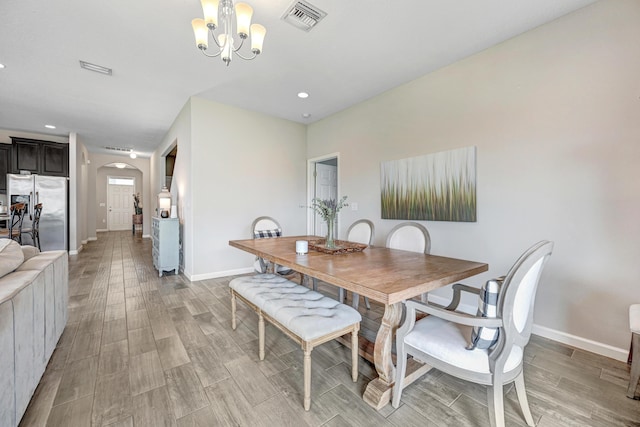 dining area with a notable chandelier