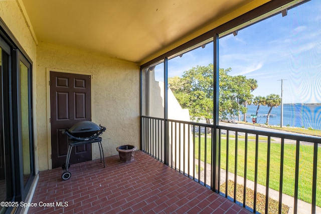 sunroom with a water view