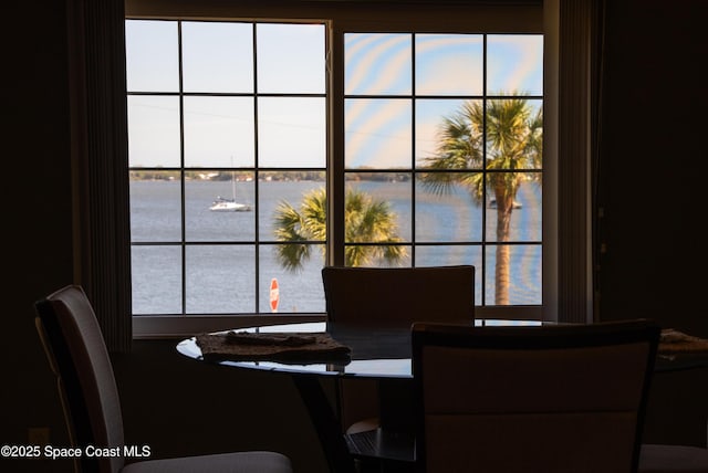 dining room with a water view