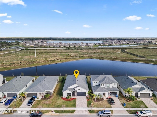 drone / aerial view with a water view