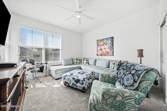 living room featuring light carpet and ceiling fan