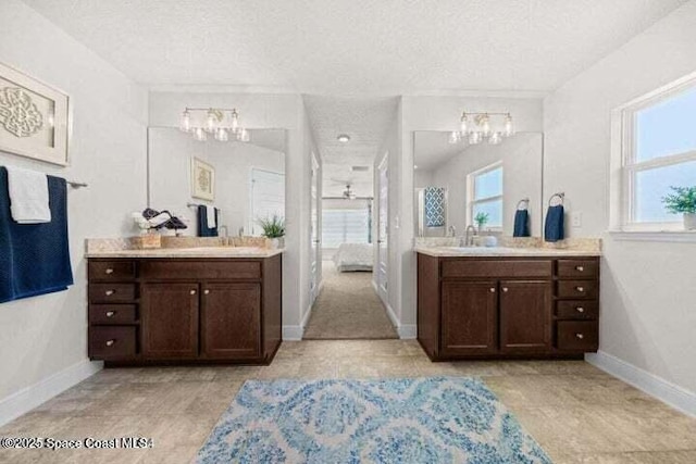 bathroom with vanity and a textured ceiling