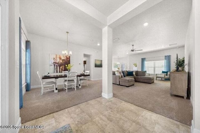 interior space with ceiling fan with notable chandelier, a textured ceiling, and carpet flooring