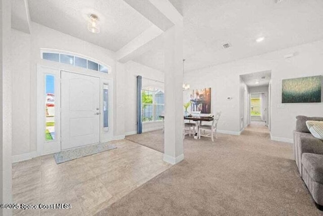 view of carpeted foyer