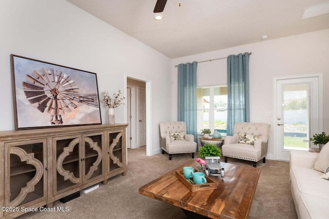 living room featuring light colored carpet and ceiling fan