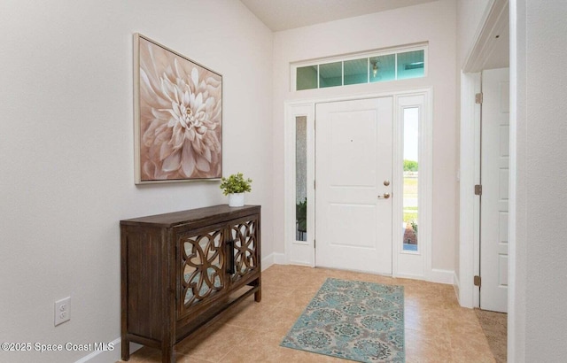 574 Fernwood Ave NW None, Unit None, Palm Bay, FL 32907 - entryway featuring light tile patterned flooring and baseboards