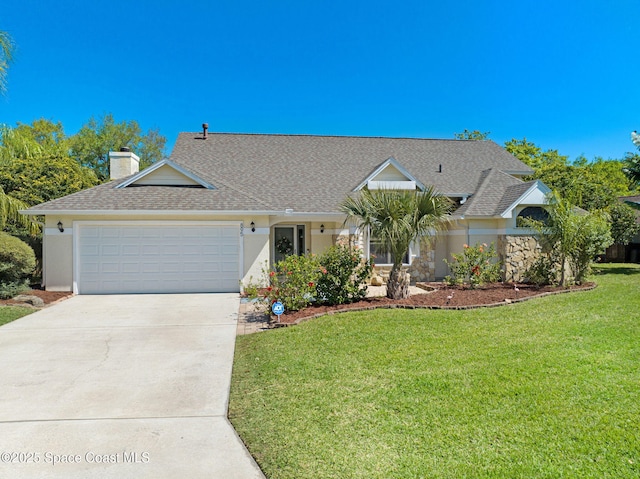 view of front facade with an attached garage, roof with shingles, concrete driveway, and a front yard