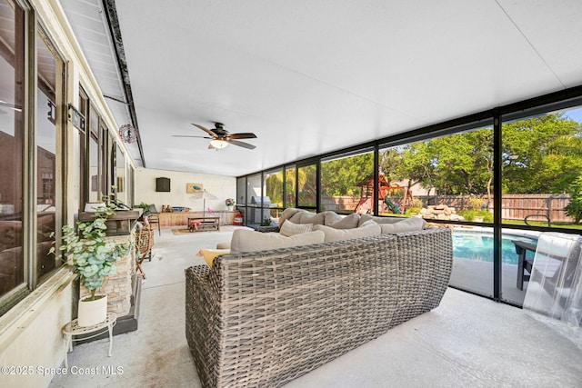 sunroom with plenty of natural light and ceiling fan