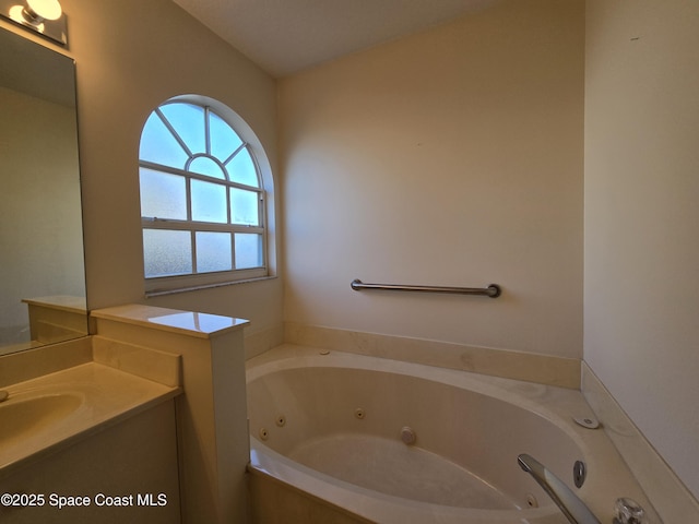 bathroom featuring vanity and a bathing tub