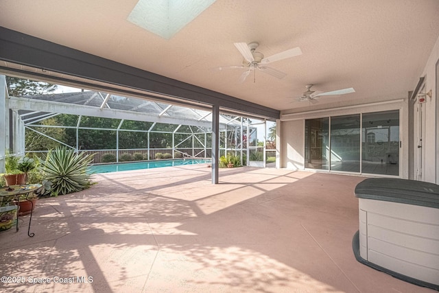 view of patio / terrace with a lanai and ceiling fan