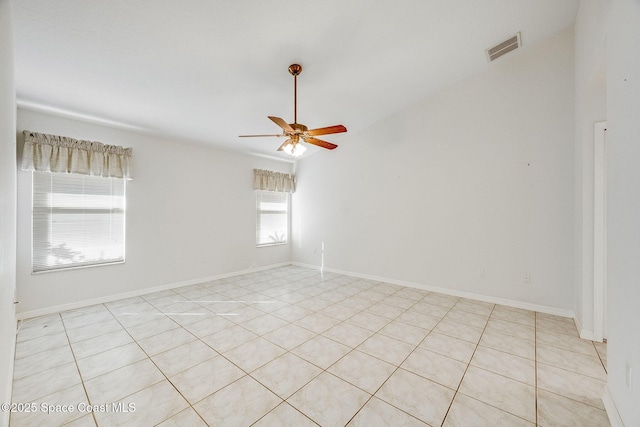 unfurnished room featuring lofted ceiling and ceiling fan