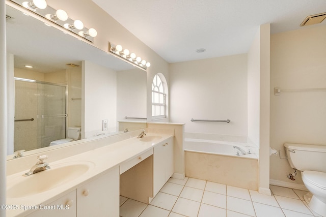 full bathroom with tile patterned flooring, vanity, separate shower and tub, and toilet