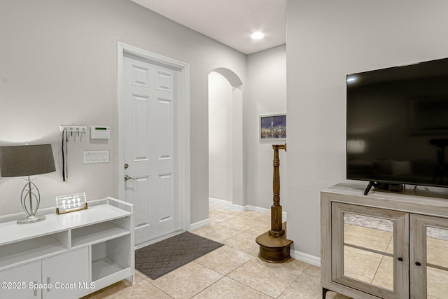 entrance foyer featuring light tile patterned floors