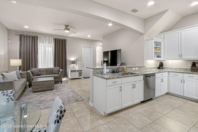 kitchen with white cabinetry, dishwasher, sink, and light stone countertops