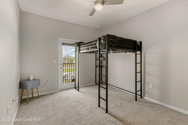 unfurnished bedroom with ceiling fan, carpet, and access to outside