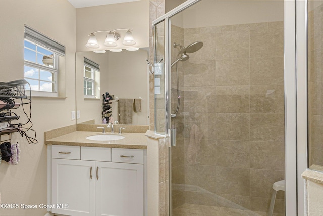 bathroom featuring an enclosed shower and vanity