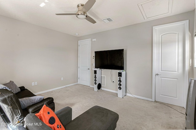 carpeted living room with ceiling fan